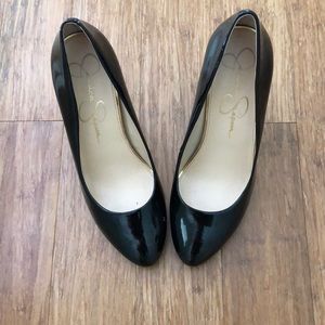 Black patten leather pumps